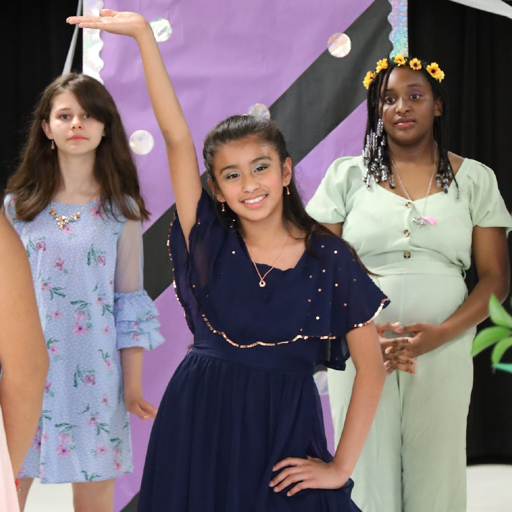 Students posing in a fashion show
